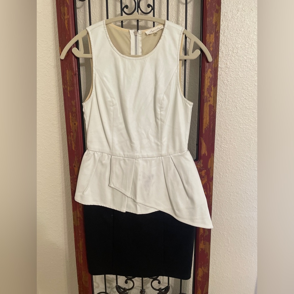 Asymmetrical leather top peplum with fabric stretch skirt HAS A STAIN